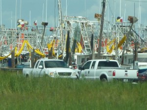 Shrimp boats with oil booms